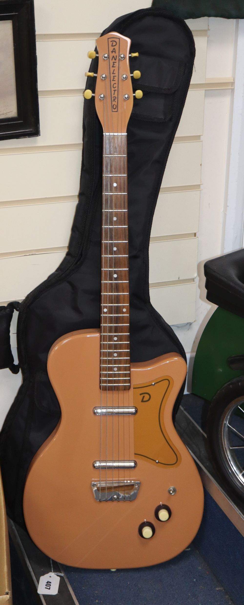 A Danelectro electric guitar with soft case